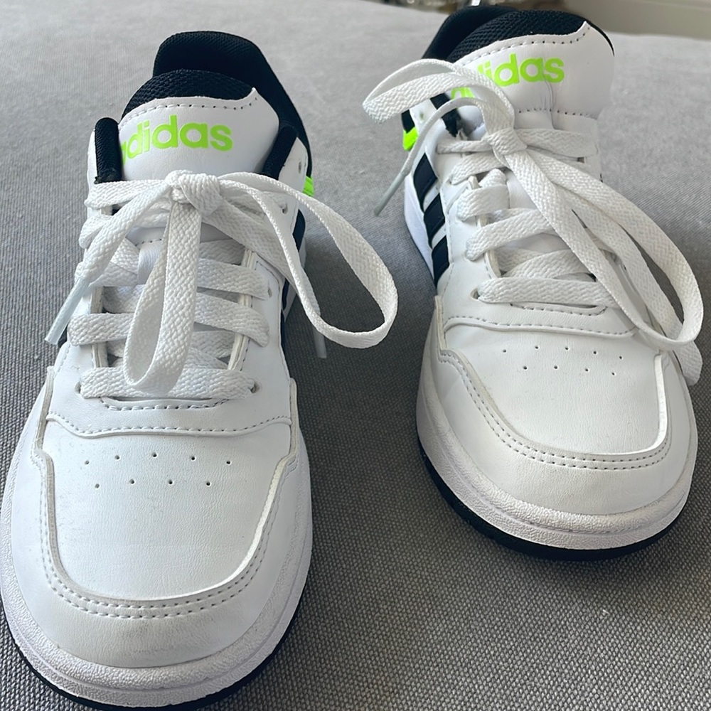 Worn once- White Adidas with black and fluorescent green details.